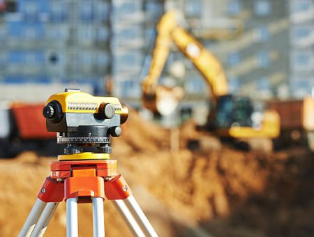 Surveyor equipment tacheometer or theodolite outdoors at construction site