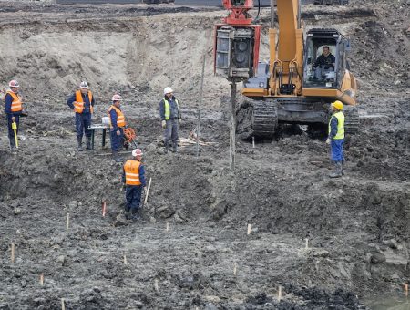 BELGRADE, SERBIA - OCTOBER 19, 2015: Engineers and soil technicians driling for standard penetration tests and sampling through soil. Site Investigations for the Belgrade Waterfront project.